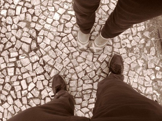 4 feet on Portuguese style sidewalk