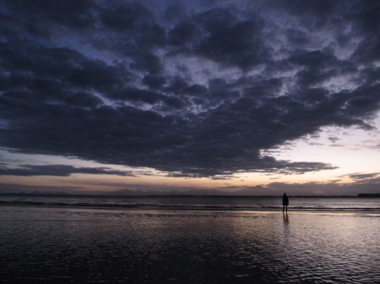 Carmen on a sandbar in the sunset
