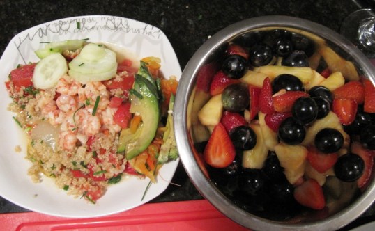Shrimp over quinoa and fruit salad