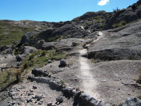 Horse worn trail on rocky hillside