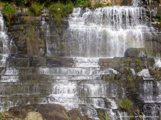 Nathan walking across waterfall