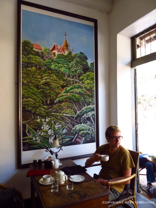 Nathan enjoying a coffee at Le Cafe Ban Vat Sene