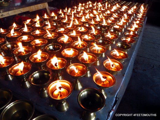 Oil lamps at the rustic Taizi Ping temple